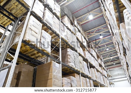 Distribution warehouse with boxes on high shelves