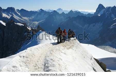 Climbers in a high winter mountain, Mont Blanc massive, France