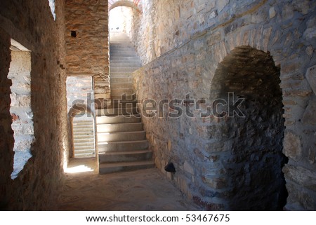 old stone castle gate with staircase and door to dungeons in an ancient style - light and darkness