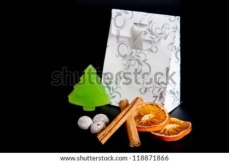 a paper-bag for christmas with a soap tree and spices