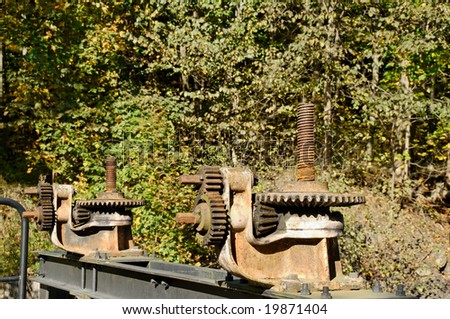Rusty gearbox on Akerselva river flood-gate