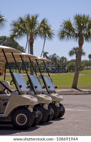 Generic club car golf carts in a parking lot in Florida.