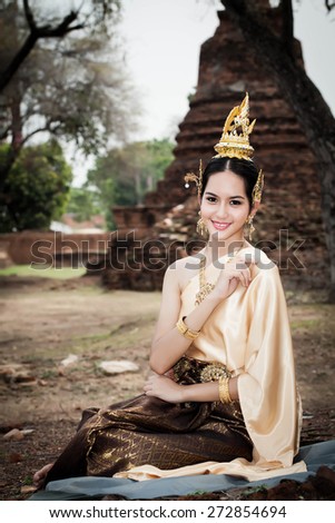 Female in Thailand traditional dress at Ayuthaya historical park