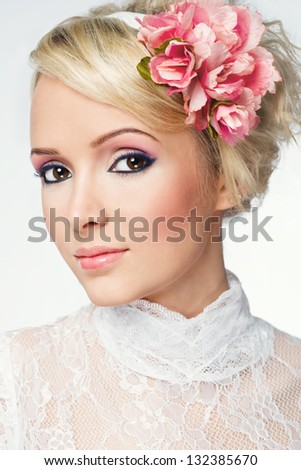 beautiful bride wearing white wedding dress with flowers on her head