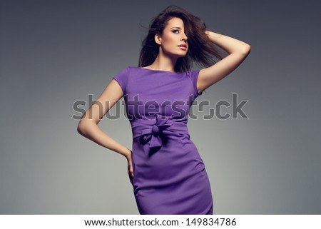 picture of young beautiful woman wearing purple dress