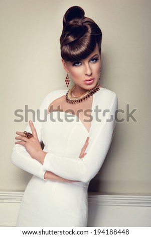 elegant beautiful woman in white dress with creative hairstyle