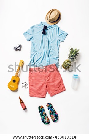 collection collage of men\'s clothing and accessories. Overhead of essentials young man on vacation. Summer outfit of casual man, camera, sunglasses.