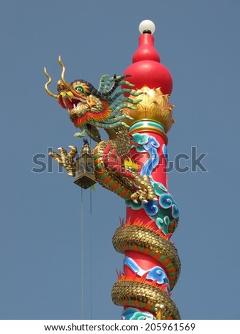 Architectural design of a dragon on a pole lamp.