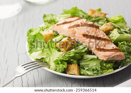Grilled Salmon Caesar Salad with Croutons, Parmesan, Caesar Dressing and Cracked Pepper