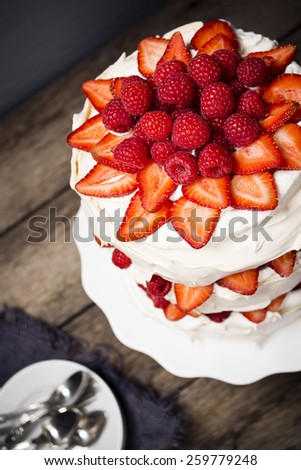 Layered Pavlova Cake, Made from Meringue, Whipped Cream, and Berries