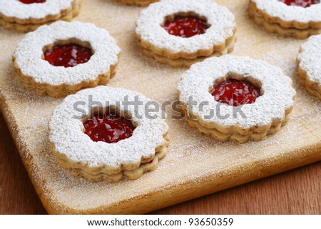 Raspberry Linzer Torte Cookies on Cutting Board