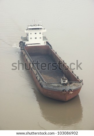 CHONGQING - MARCH 16: A cargo ship on the Yangtze River on March 16, 2012 in Chongqing, China. The Yangtze River is the longest river in Asia and the third longest in the world. It flows for 6,418 km.