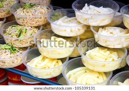 CHONGQING - MARCH 19: A street vendor selling noodles on March 19, 2012 in Chongqing. According to the Food and Agriculture Organization, 2.5 billion people eat street food every day.