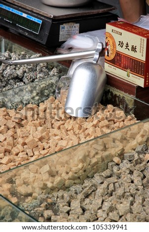 CHONGQING - MARCH 19: A stall selling traditional sweets in a street on March 19, 2012 in Chongqing. According to the Food and Agriculture Organization, 2.5 billion people eat street food every day.