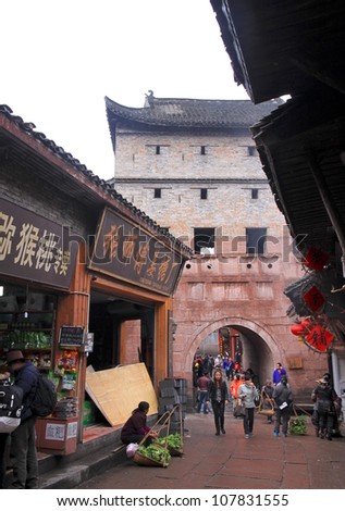 FENGHUANG - MARCH 23: A busy street on March 23, 2012 in Fenghuang, China. Over half of Fenghuang\'s population belongs to the Hmong/Miao or Tujia minorities.