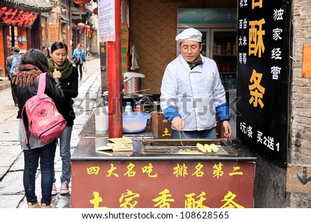 FENGHUANG - MARCH 23: Traditional street food on March 23, 2012 in Fenghuang County. According to the Food and Agriculture Organization, 2.5 billion people eat street food every day.