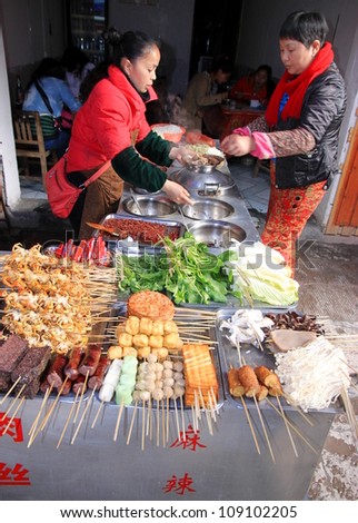 FENGHUANG - MARCH 23: Traditional street food on March 23, 2012 in Fenghuang County. According to the Food and Agriculture Organization, 2.5 billion people eat street food every day.