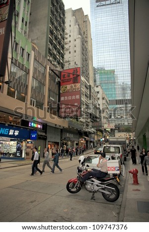 HONG KONG - MARCH 30: A busy street on March 30, 2012 in Hong Kong. With a land mass of 1,104 km2 and a population of 7 million people Hong Kong is one of the most densely populated areas in the world