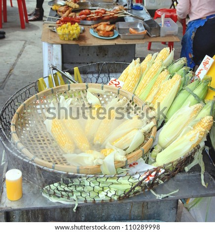 HONG KONG - MARCH 31: Corn cobs at a Chinese street market on March 31, 2012 in Hong Kong. According to the Food and Agriculture Organization, 2.5 billion people eat street food every day.