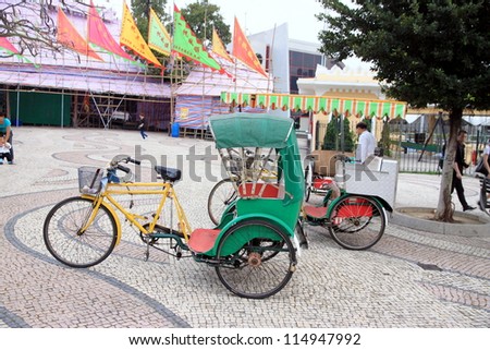 MACAU - APRIL 2: A rickshaw in a street on April 2, 2012 in Macau. Most manual rickshaws were eliminated in China after the founding of the People\'s Republic of China in 1949.