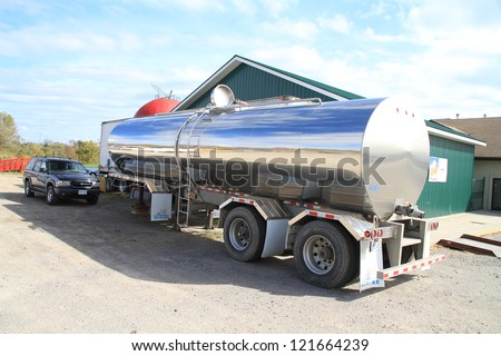 TORONTO - OCTOBER 8: An oil tanker truck parked outside a factory on October 8, 2012 in Toronto. Large trucks typically have capacities ranging from 5,500 to 9,000 US gallons.