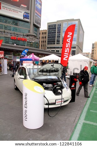 TORONTO - NOVEMBER 23: A street event promoting a 100% electric Nissan car on November 23, 2012 in Toronto. Over 4.6 of Nssan vehicles were sold globally in the year 2011.