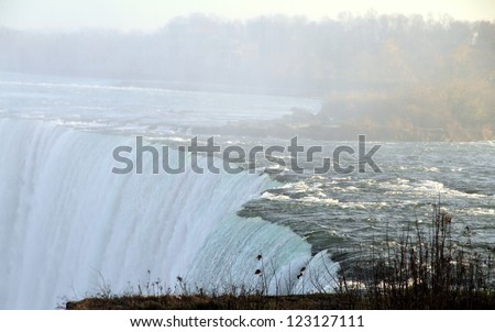 NIAGARA FALLS - NOVEMBER 16: A view of the Niagara Falls on November 16, 2012 in Niagara Falls, Canada. More than 4 million cubic feet of water falls over the crest line every minute on average flow.