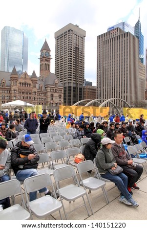 TORONTO - MAY 13: People attending the Falun Dafa World Day on May 13, 2013 in Toronto. Hundreds of thousands are believed to practice Falun Gong outside China across some 70 countries worldwide.
