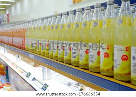 TORONTO, CANADA - JANUARY 31, 2014: Fruit juice bottles lined up on a supermarket shelf in Toronto, Canada.