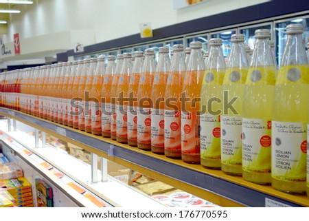 TORONTO, CANADA - JANUARY 31, 2014: Fruit juice bottles lined up on a supermarket shelf in Toronto, Canada.