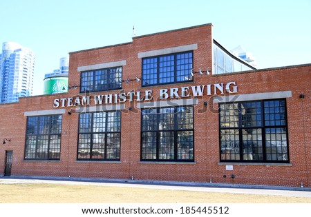 TORONTO, CANADA - APRIL 2, 2014: The Steam Whistle Brewing landmark building in Toronto. Steam Whistle Brewing is a brewery in Toronto, Ontario.