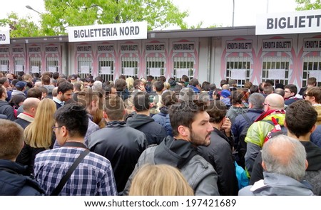 MILAN, ITALY - APRIL 19, 2014: People lining up to buy tickets for an AC Milan home game outside San Siro Stadium in Milan.