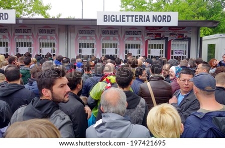 MILAN, ITALY - APRIL 19, 2014: People lining up to buy tickets for an AC Milan home game outside San Siro Stadium in Milan.