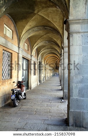 LUCCA, ITALY - APRIL 24, 2014: An ancient arcade in the center of the city of Lucca, Italy.