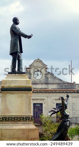 MATANZAS, CUBA - DECEMBER 14, 2014: Statue and clock tower in the central square of Matanzas, Cuba.