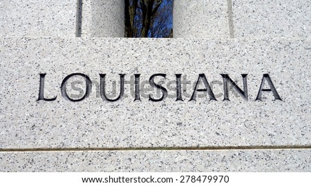 Word Louisiana engraved in the stone