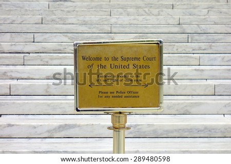 WASHINGTON DC, U.S.A. - APRIL 14, 2015: The sign at the entrance of the United States Supreme Court building in Washington DC.