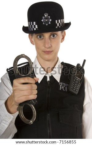 stock photo Woman Police officer with stern look showing handcuffs about 