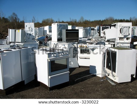 White goods in a dump with no visual brand names.