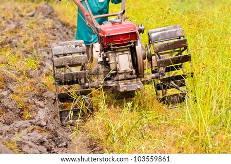 hard working farmer preparing the ground for the growth of rice in the north east of thailand