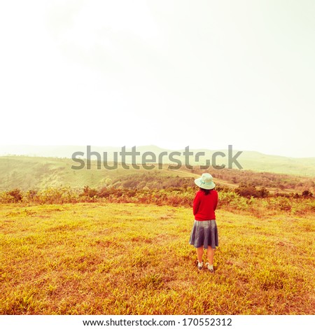 Vintage, Alone woman is standing with mountain views at countryside