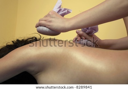 Girl relaxing. Massage salon with accessories. Anti stress massage.