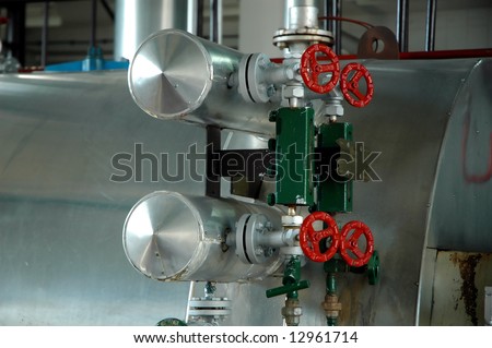 Valves on a pipeline. Red colored