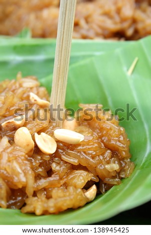 thai dessert made from stirred glutinous rice with brown sugar. It is named Khao-Neow-Peak.