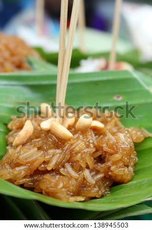 thai dessert made from stirred glutinous rice with brown sugar. It is named Khao-Neow-Peak.