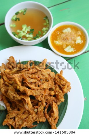 deep fried sajor-caju mushroom patty or mushroom cake serve with vegetable soup and its sauce