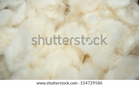 pile of cotton ball while making cotton yarn