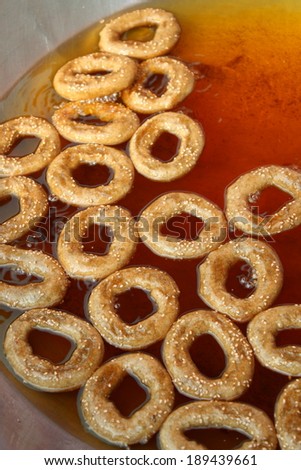 traditional donut made from thai black rice flour while frying in vegetable oil-rich  big pan