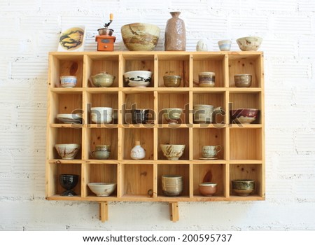 wooden display window of home-made ceramic container