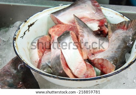 fish slice in old bowl for retail sale in local market